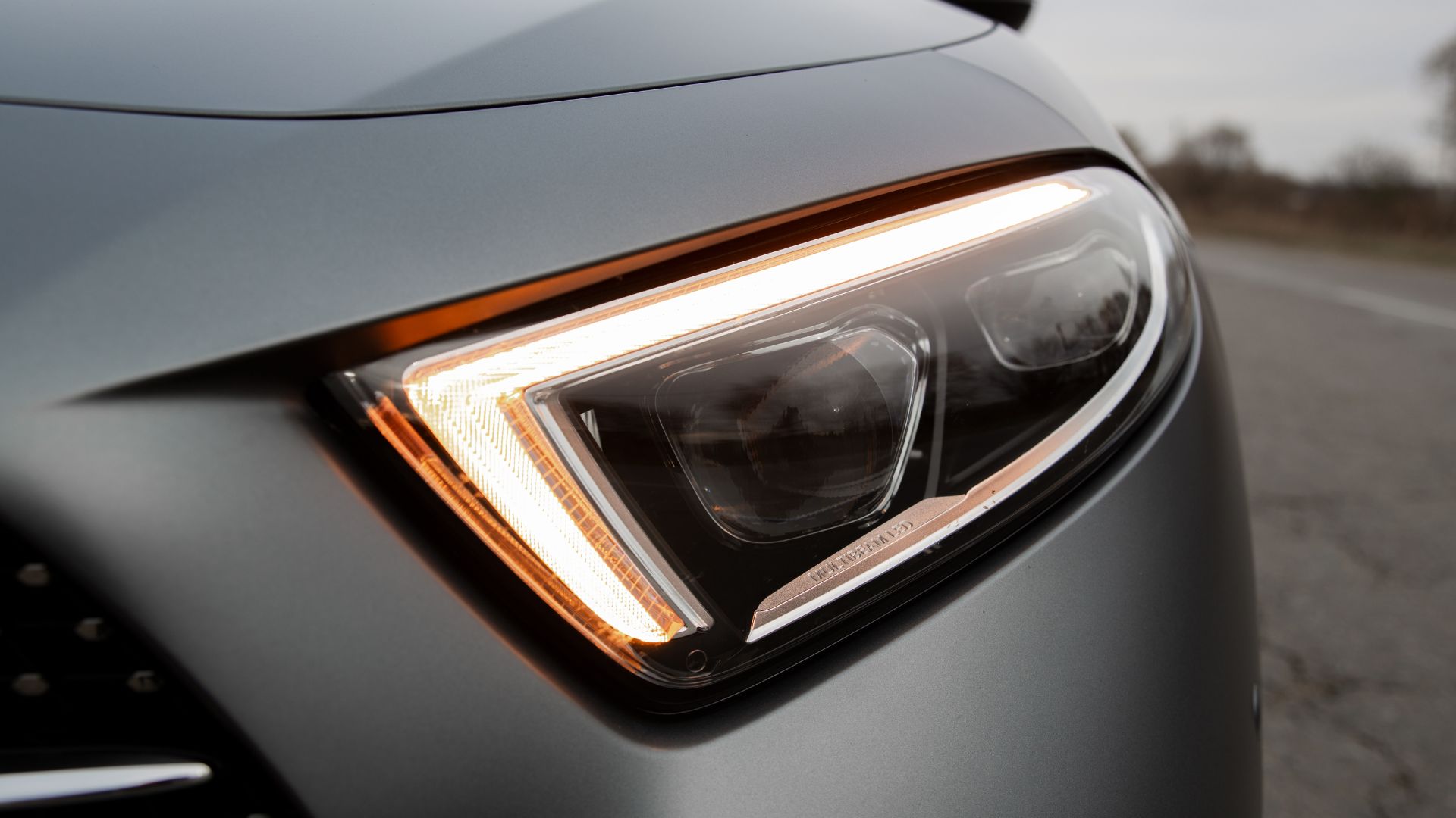 Modern car headlight with sleek design and illuminated LED daytime running light